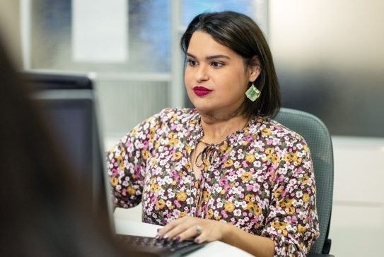 Mabel works diligently at her computer.